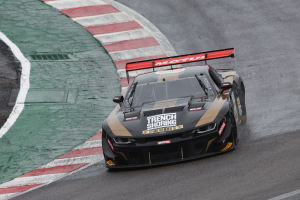 PHOTO: Tomy Drissi drives through WeatherTech Raceway Laguna Seca's famous Corkscrew in the #8 Trench Shoring Company/Motul/Franklin Road Apparel Chevrolet Camaro.